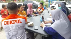 Sapa Pengemudi Ojol di Hari Buruh, Sidokkes Polres Kukar Gelar Cek Kesehatan Gratis