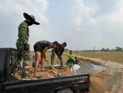 TMMD Membangun Negeri, Satgas Ke-129 Lanjutkan Pembangunan Jalan Lingkungan di Leuwi Malang