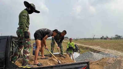 TMMD Membangun Negeri, Satgas Ke-129 Lanjutkan Pembangunan Jalan Lingkungan di Leuwi Malang