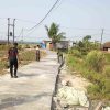 Jaga Kekuatan Beton, Satgas TMMD Ke-129 Siram Jalan Sasaran 3